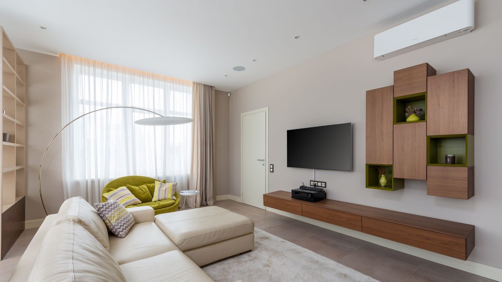 Wall-mounted ductless mini-split heat pump in a residential living room, proving heat pumps florida do they work
